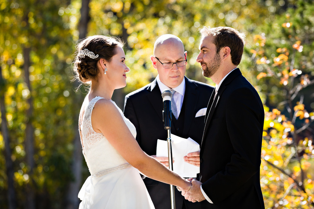 absaroka-beartooth-wilderness-montana-wedding-ceremony-bride-groom-hold-hands.jpg