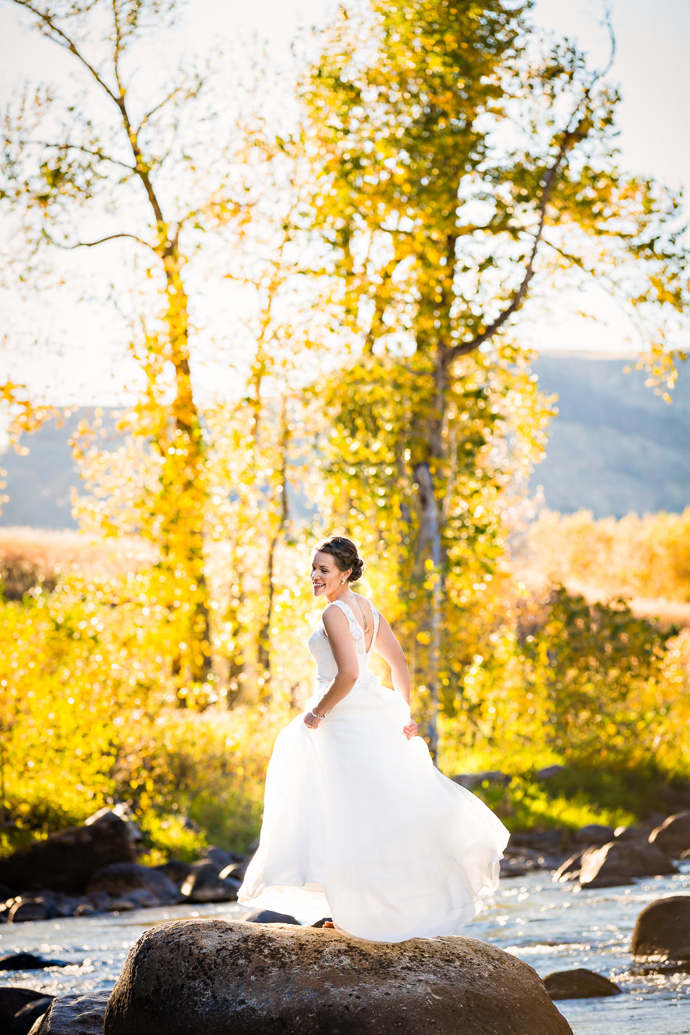 absaroka-beartooth-wilderness-montana-wedding-reception-bride-crosses-river.jpg