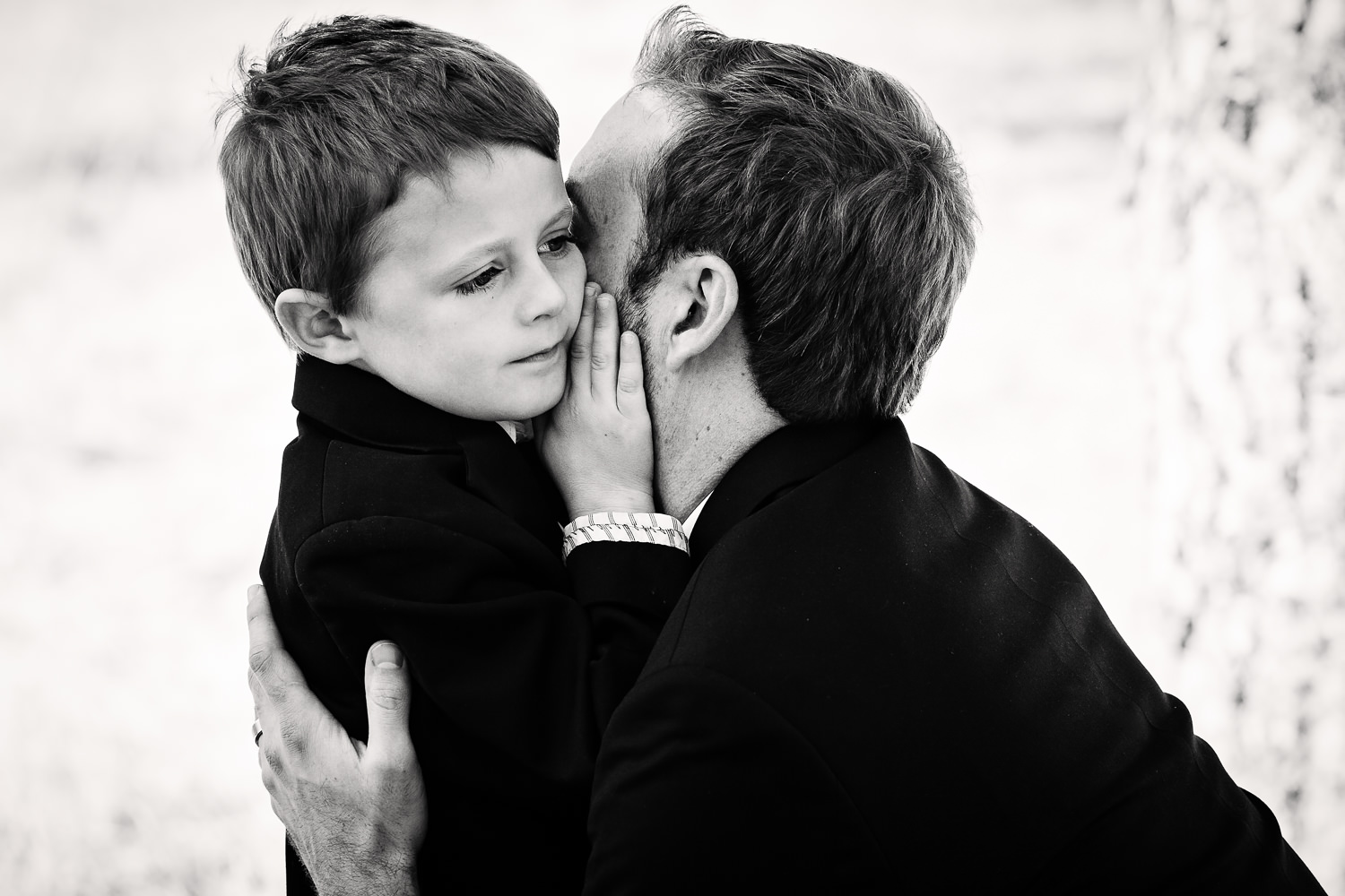 absaroka-beartooth-wilderness-montana-wedding-reception-groom-hugs-son.jpg