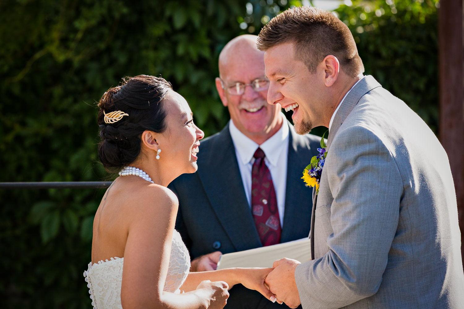 billings-montana-chanceys-wedding-ceremony-groom-bride-laughing.jpg