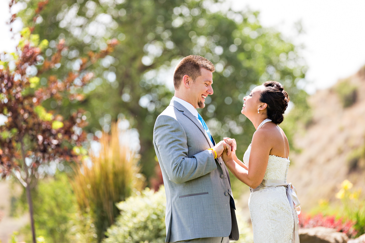 billings-montana-chanceys-wedding-first-look-bride-groom-holding-hands.jpg