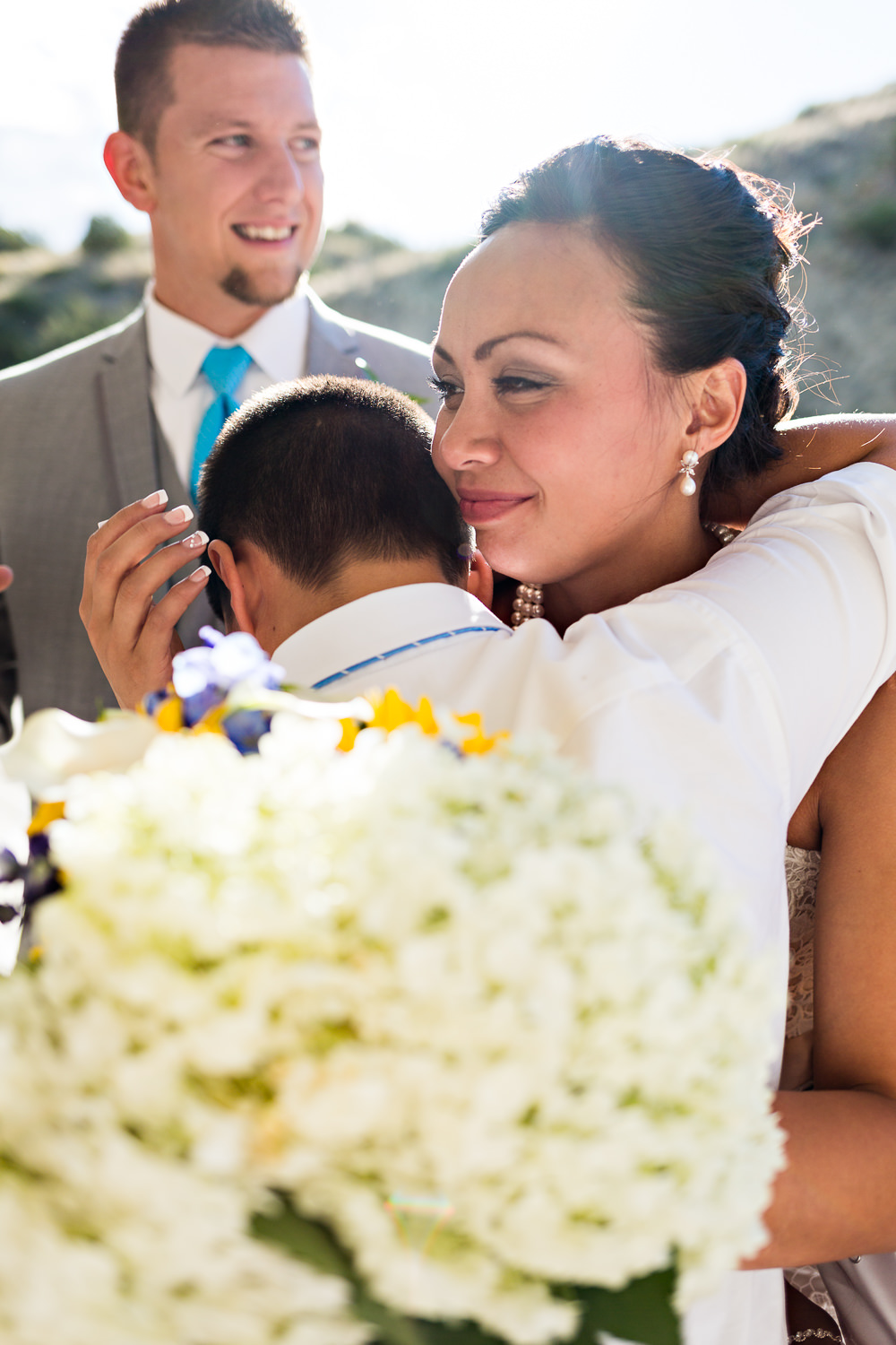billings-montana-chanceys-wedding-reception-bride-hugs-nephew.jpg