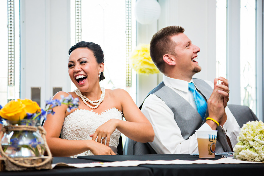 billings-montana-chanceys-wedding-reception-bride-laughs-during-toasts.jpg