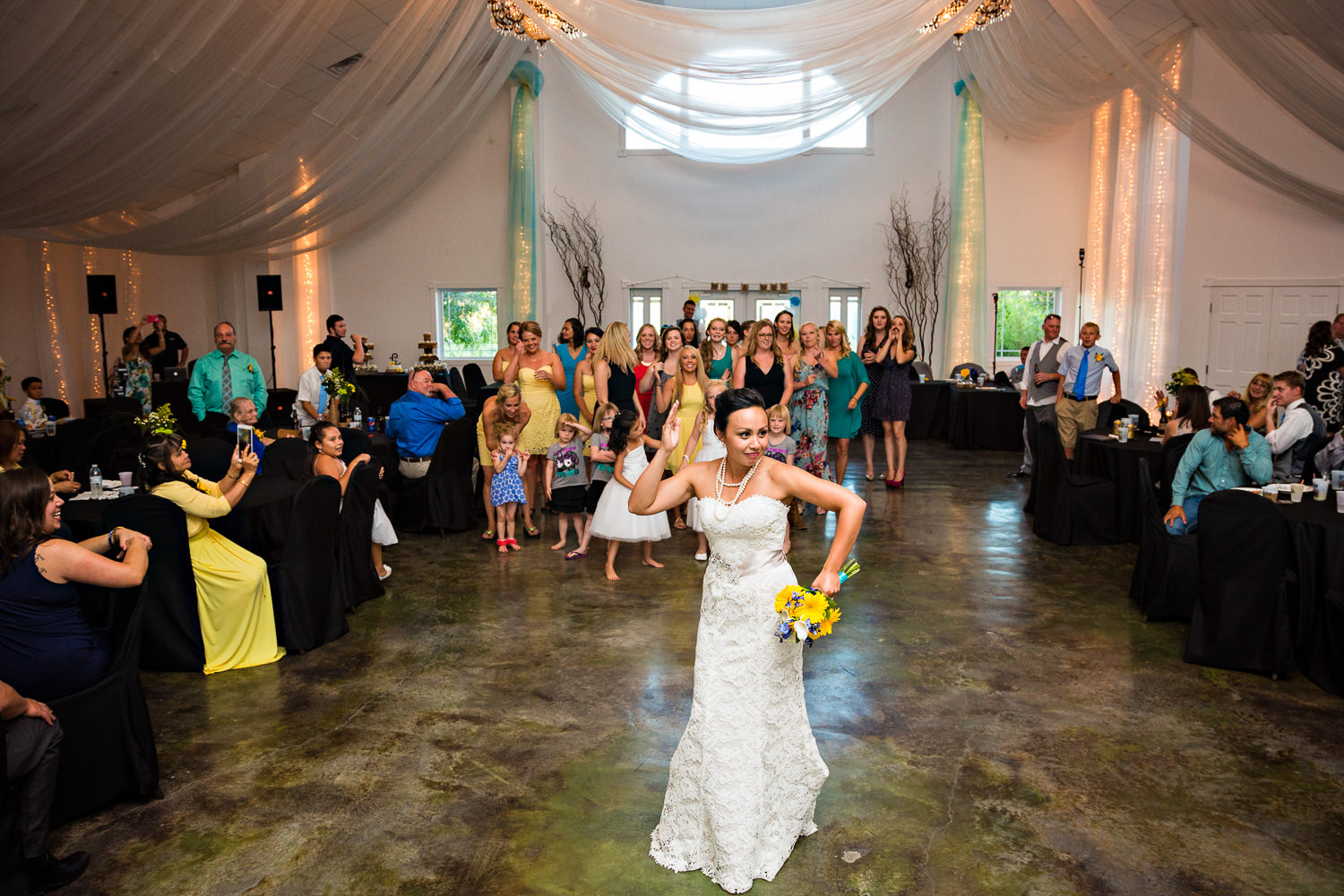 billings-montana-chanceys-wedding-reception-bride-tosses-bouquet.jpg