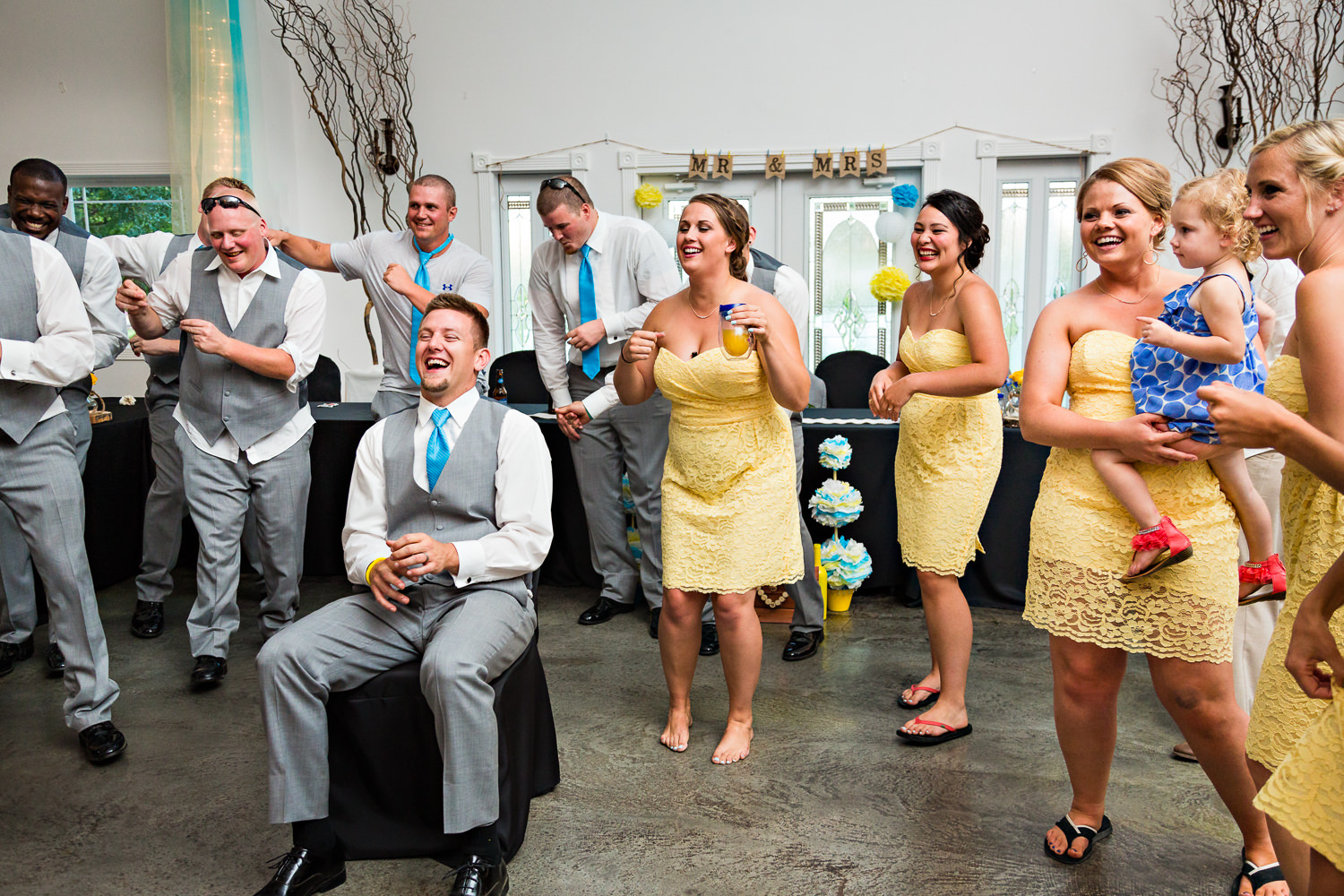 billings-montana-chanceys-wedding-reception-groom-laughing-during-bride-performance.jpg