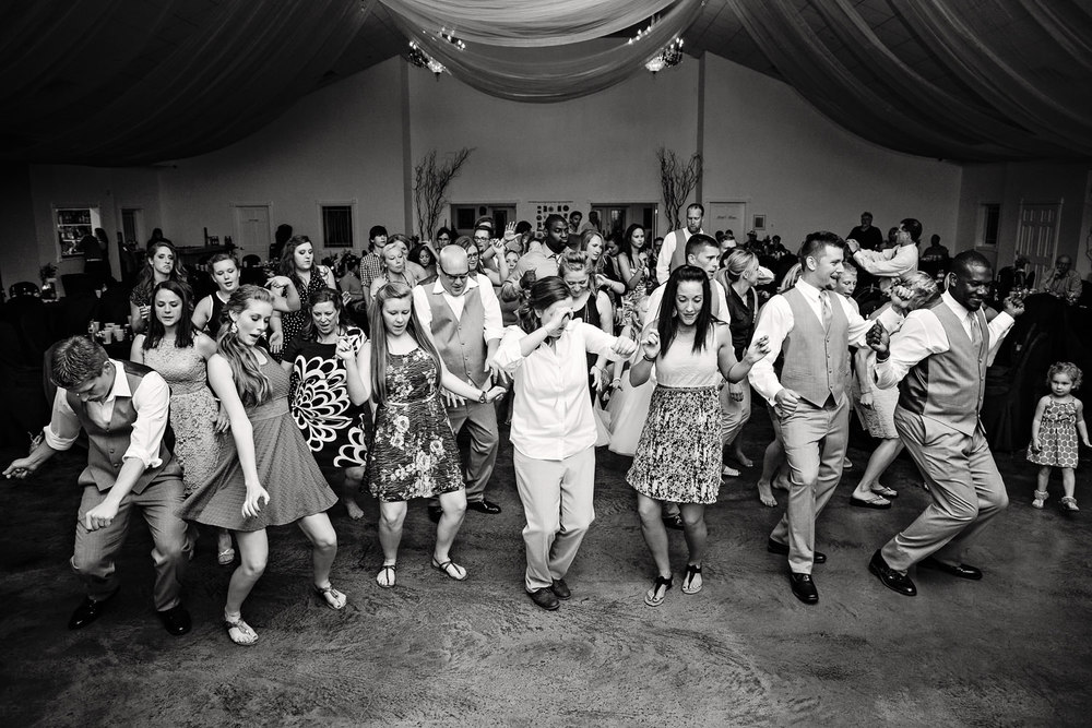 billings-montana-chanceys-wedding-reception-guests-dance-together.jpg