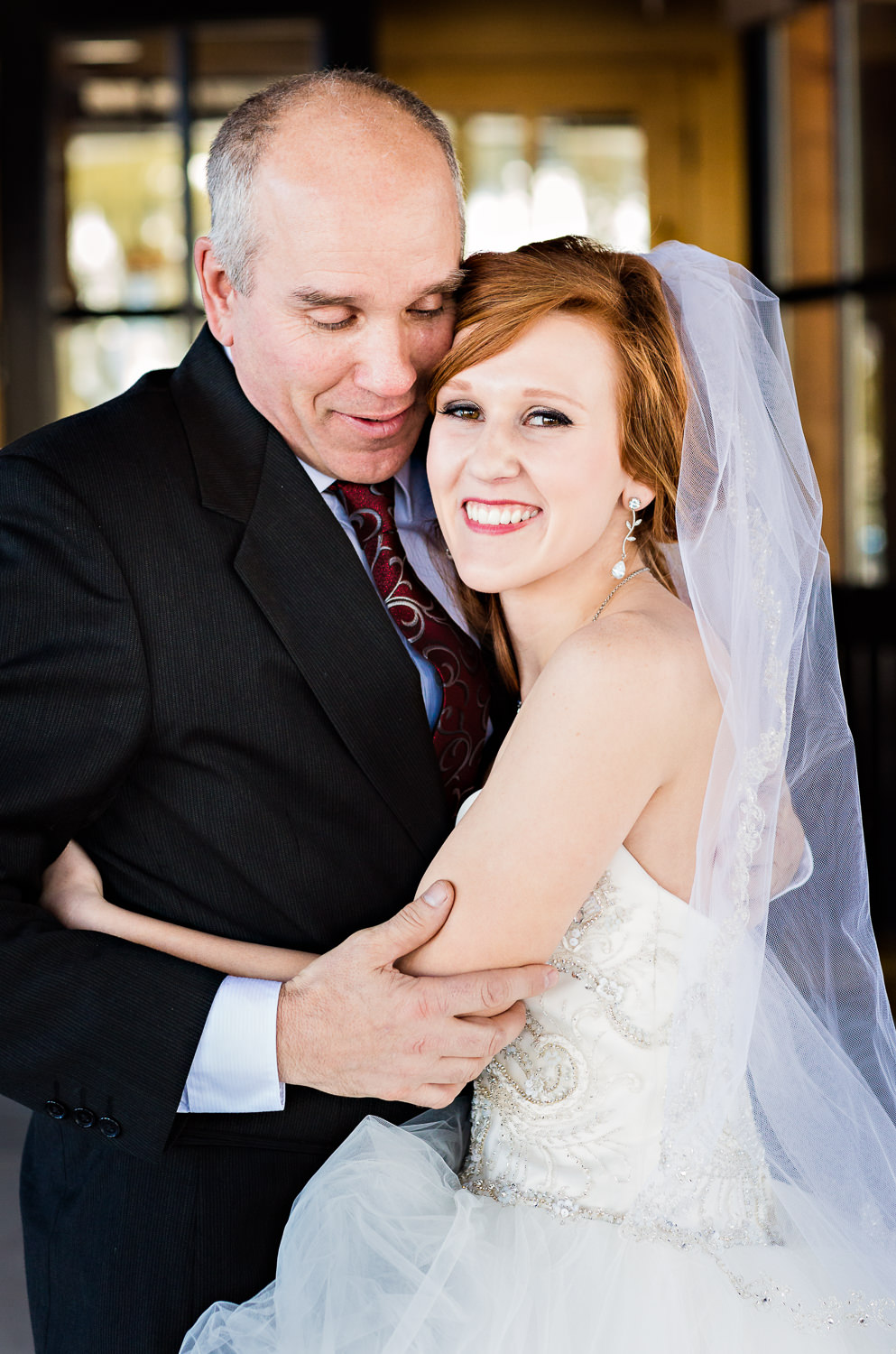 big-sky-montana-winter-wedding-breanna-father-first-look-bride-hugs-dad.jpg