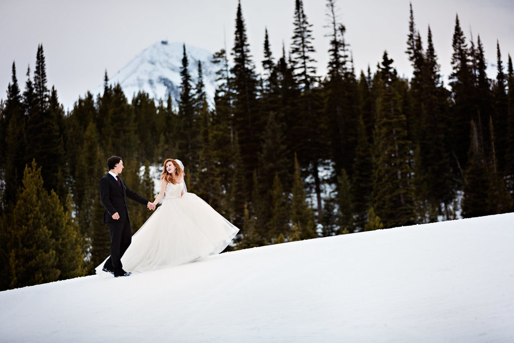 big-sky-montana-winter-wedding-breanna-first-look-bride-groom-dancing-in-the-snow.jpg