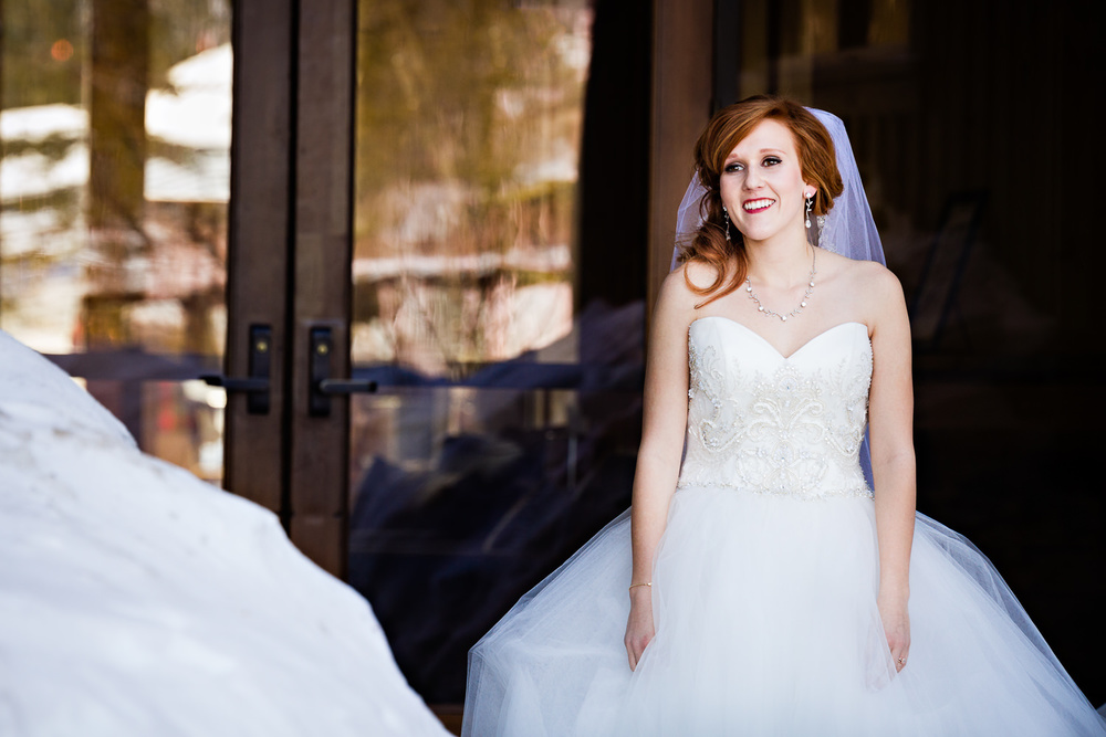 big-sky-montana-winter-wedding-breanna-first-look-bride-smiling.jpg