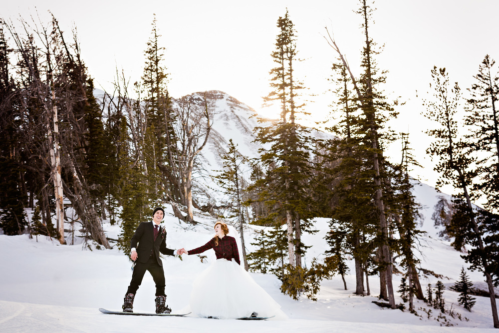 big-sky-montana-winter-wedding-breanna-formals-bride-groom-holding-hands.jpg
