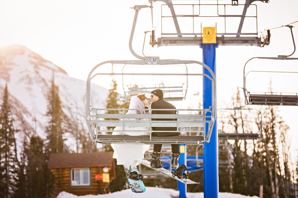 big-sky-montana-winter-wedding-breanna-formals-bride-groom-ride-chairlift.jpg
