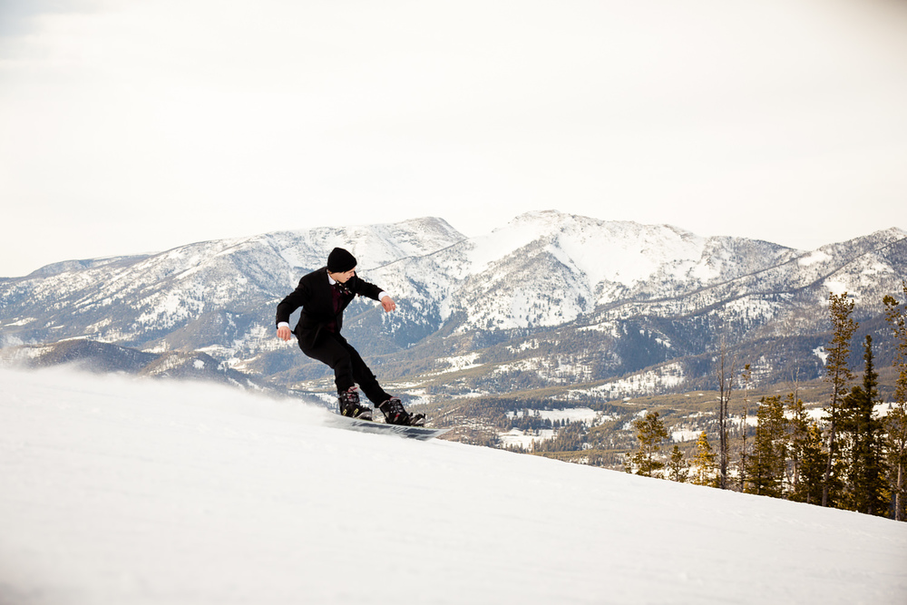 big-sky-montana-winter-wedding-breanna-formals-groom-snowboarding.jpg