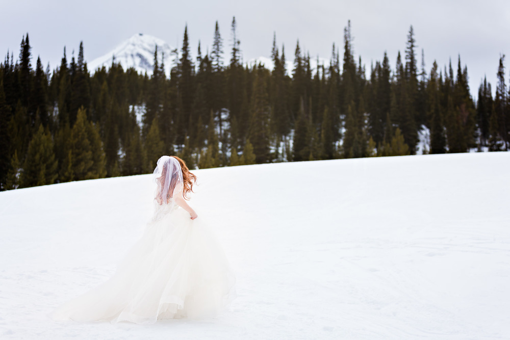 big-sky-montana-winter-wedding-breanna-first-look-bride-in-snowy-scene.jpg