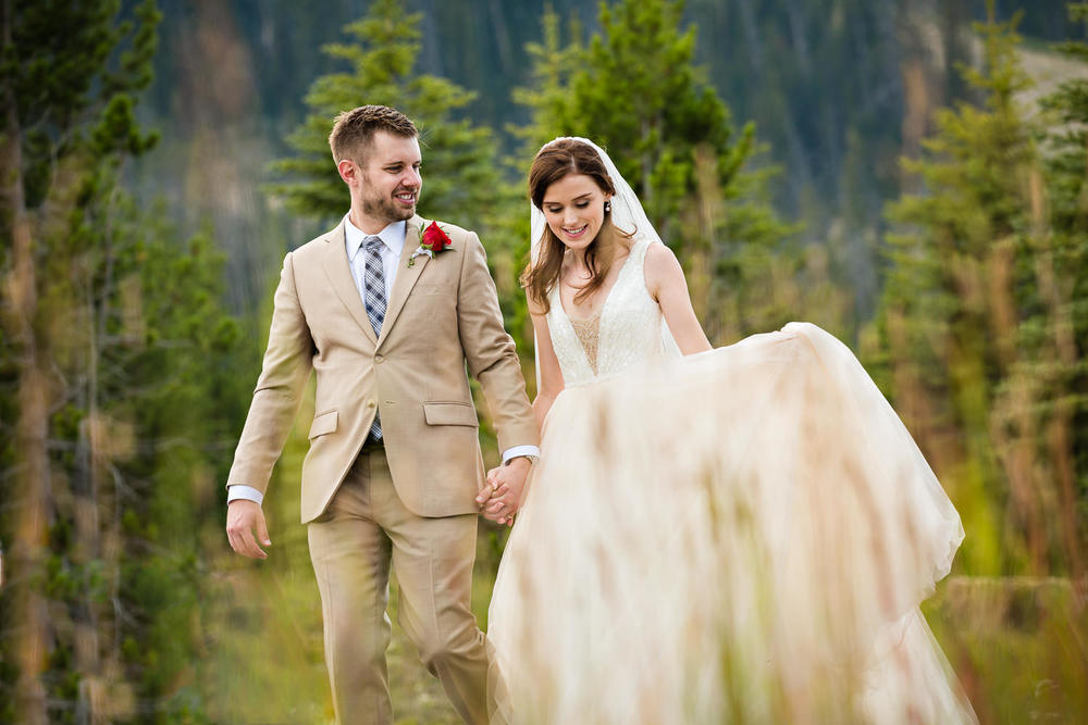 big-sky-wedding-becky-brockie-photography-couple-walk-forest.jpg