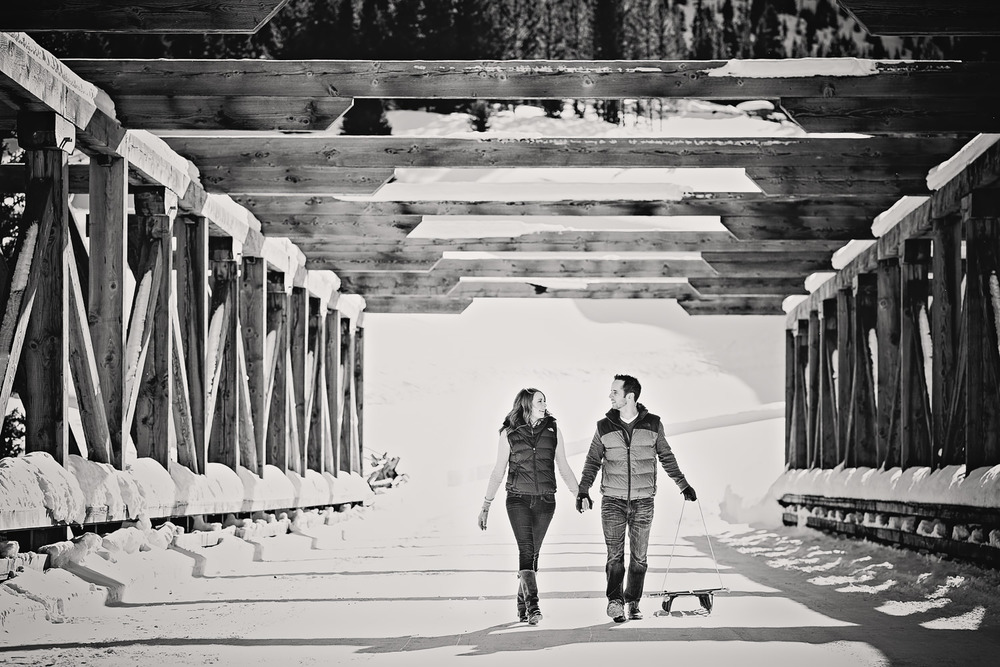 big-sky-montana-winter-engagement-session-couple-pulling-sleds.jpg