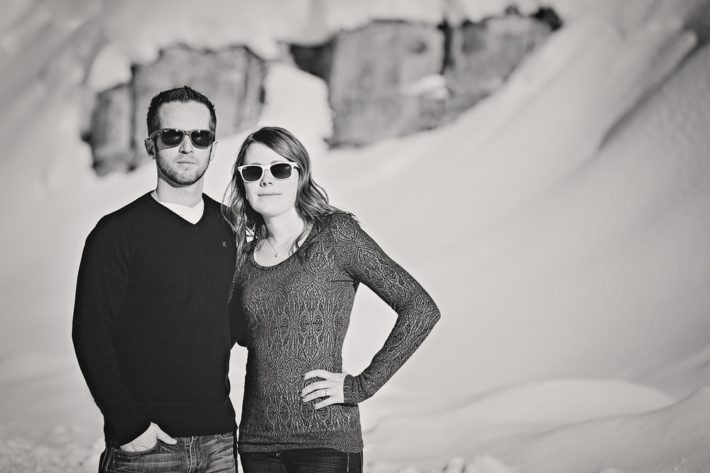 big-sky-montana-winter-engagement-session-couple-wearing-ray-bans.jpg
