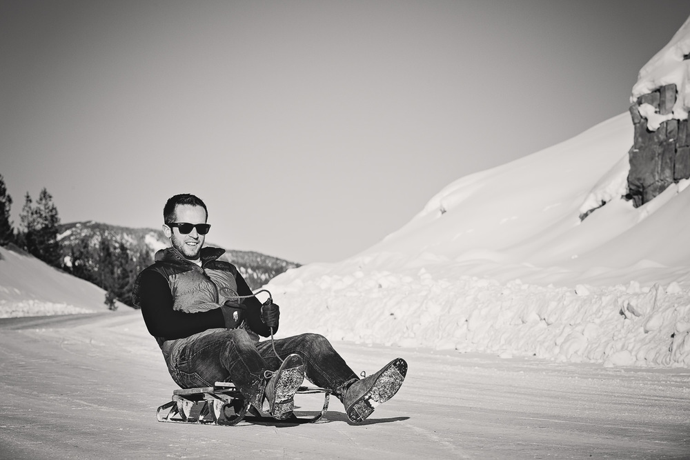 big-sky-montana-winter-engagement-session-man-sleds.jpg