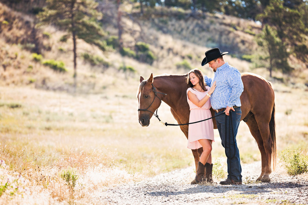 billings-montana-engagement-session-couple-look-at-horse.jpg