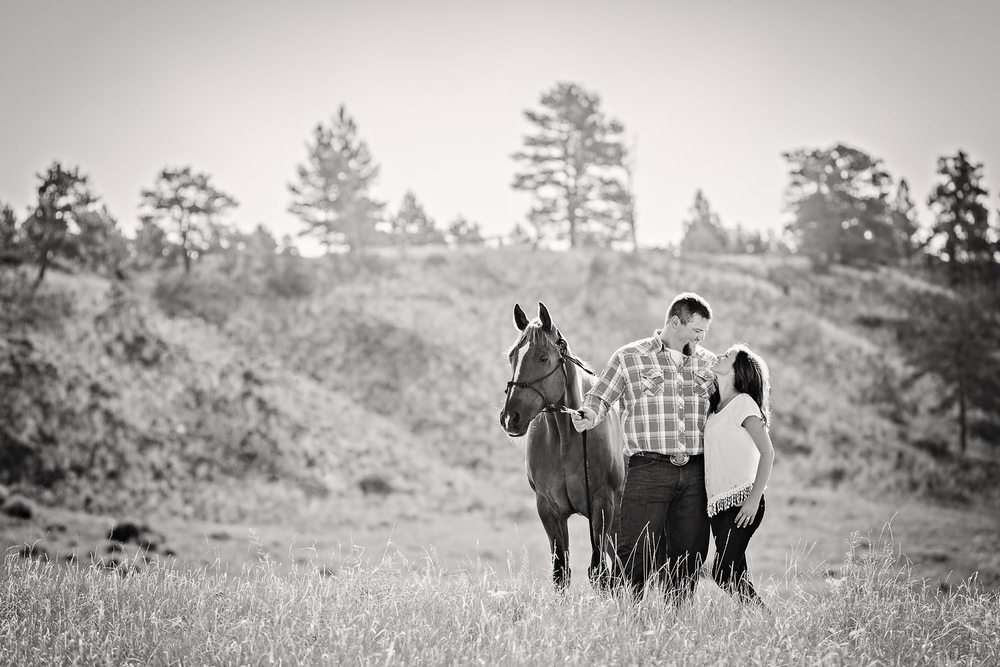 billings-montana-engagement-session-happy-couple-in-field-with-their-horse-back-and-white.jpg