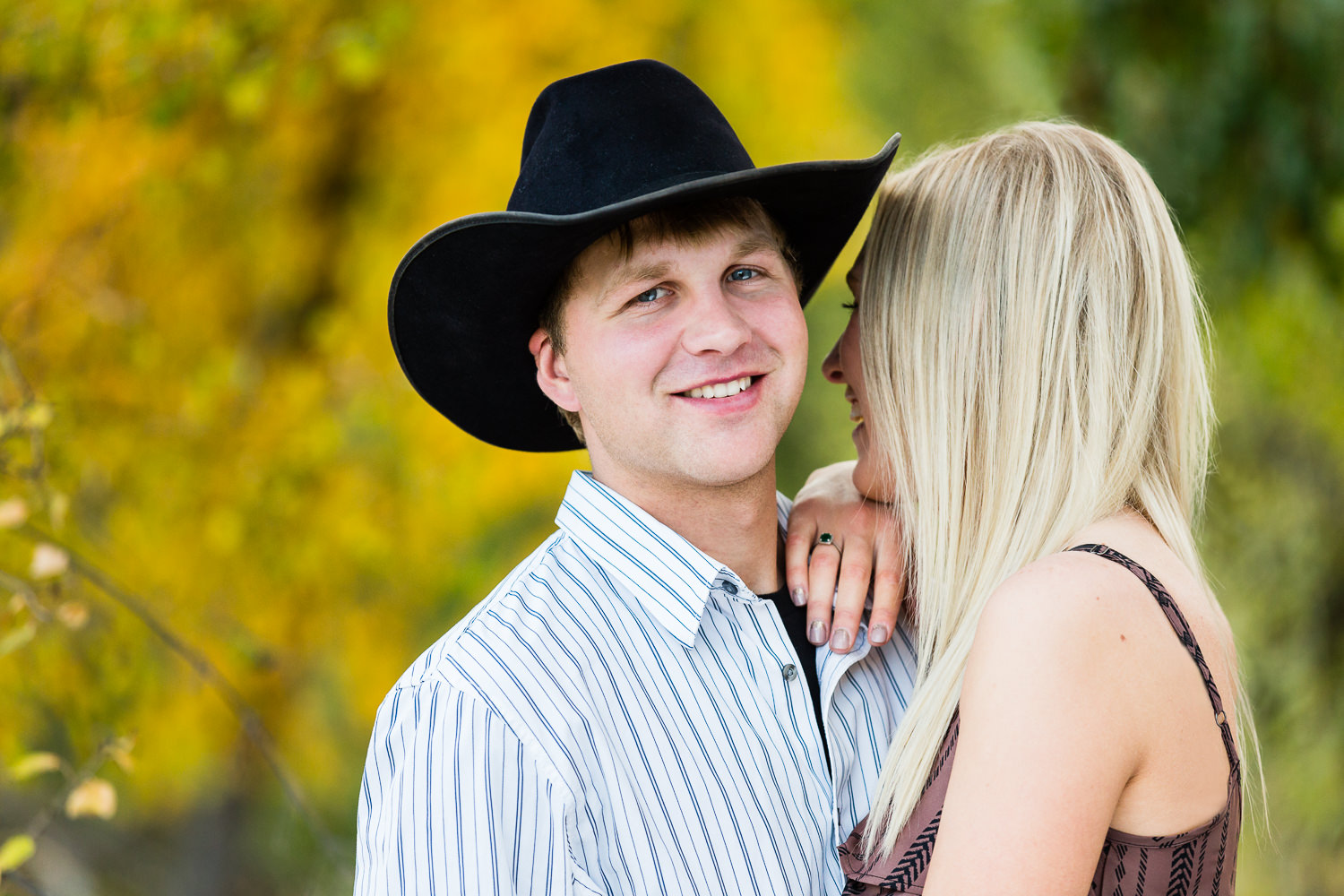 Billings-Montana-fall-engagement-photo-featuring-man-with-cowboy-hat.jpg