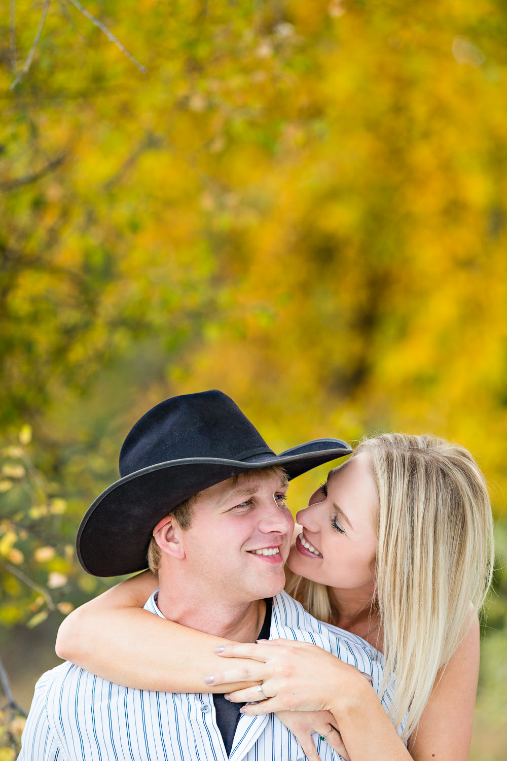 Billings-Montana-fall-engagement-woman-and-cowboy-laughing.jpg