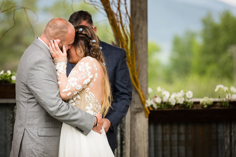 bozeman-hart-ranch-wedding-bride-groom-hug-during-ceremony.jpg