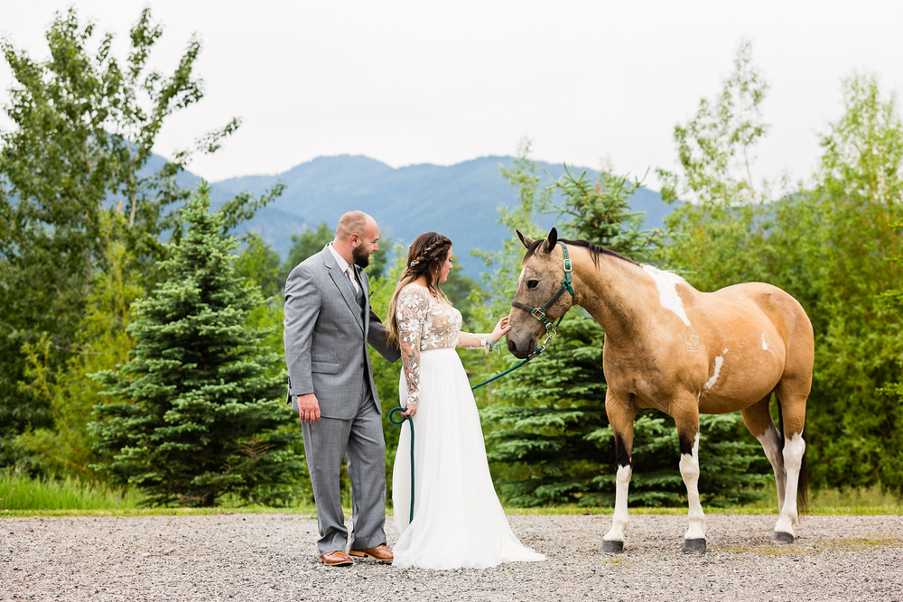 bozeman-hart-ranch-wedding-bride-groom-with-horse.jpg