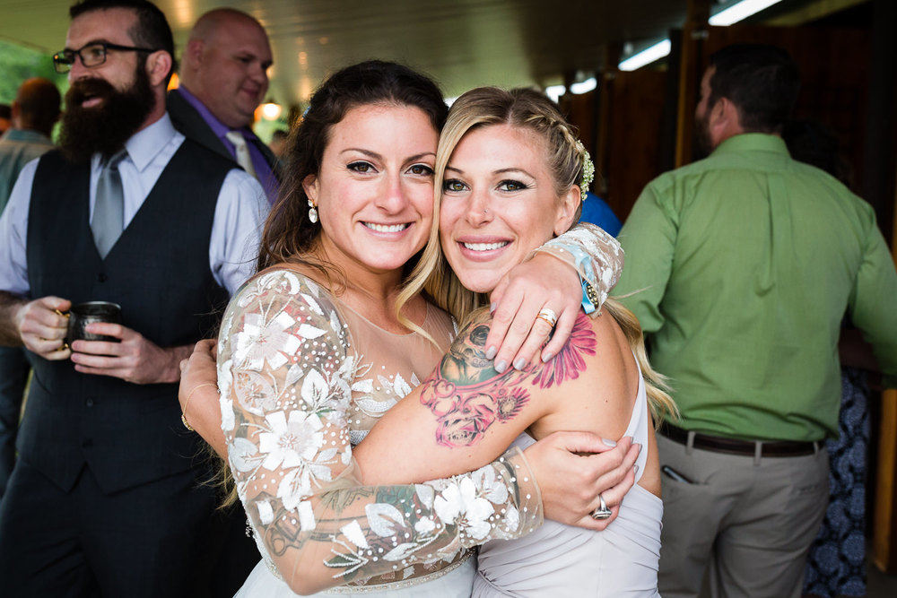 bozeman-hart-ranch-wedding-bride-and-best-friend-hug.jpg