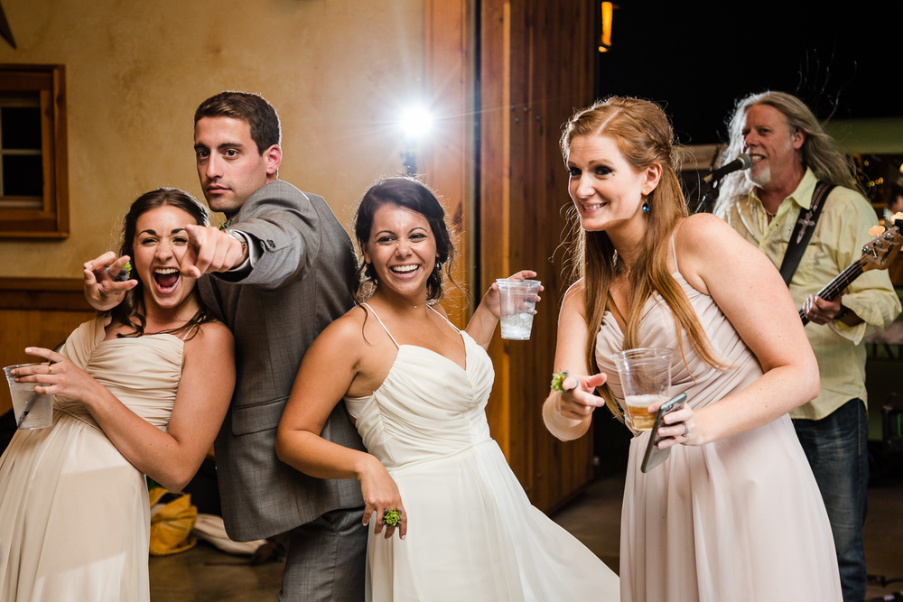 bozeman-hart-ranch-wedding-guests-laugh-at-reception.jpg