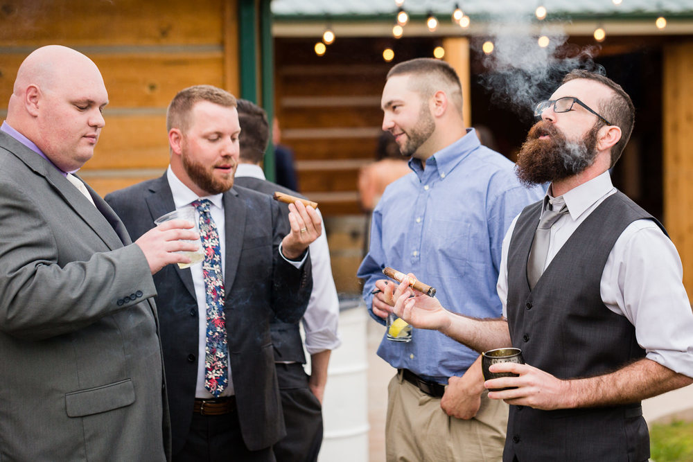 bozeman-hart-ranch-wedding-guests-smoke-cigar.jpg