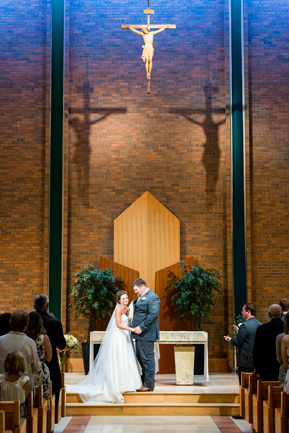 billings-montana-swift-st-thomas-ceremony-bride-groom-after-kiss.jpg
