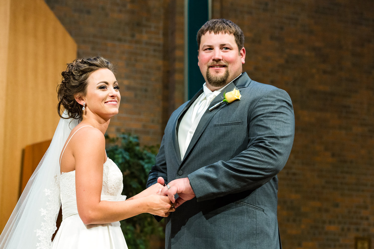 billings-montana-swift-st-thomas-couple-smiling-at-guests.jpg