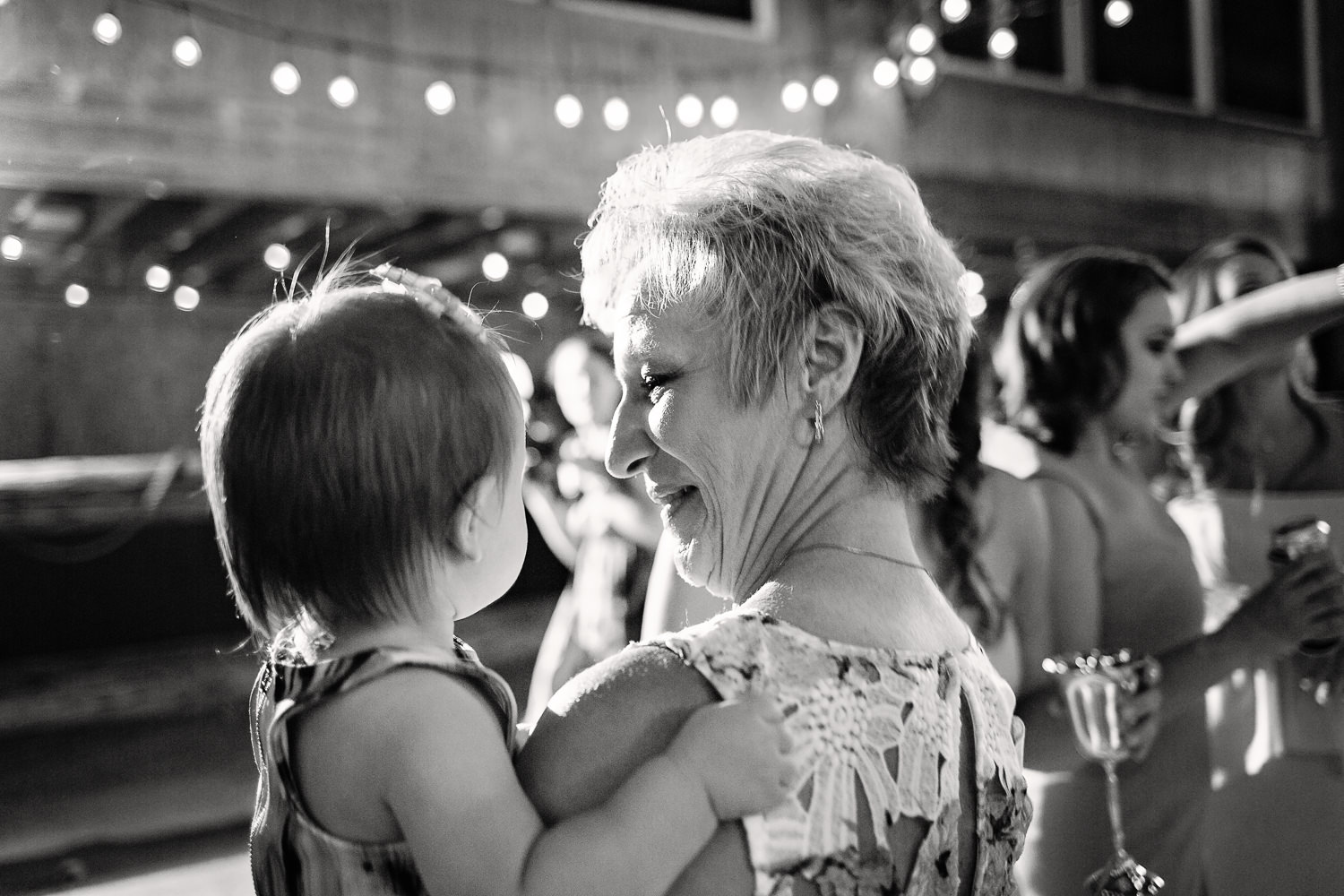 billings-montana-swift-river-ranch-wedding-guest-dancing-with-child.jpg