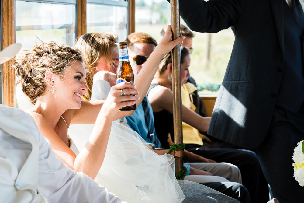 billings-montana-swift-river-ranch-wedding-reception-bride-rides-trolley.jpg