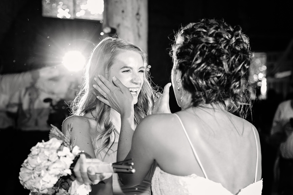 billings-montana-swift-river-ranch-wedding-reception-bride-with-girl-who-caught-bouquet.jpg