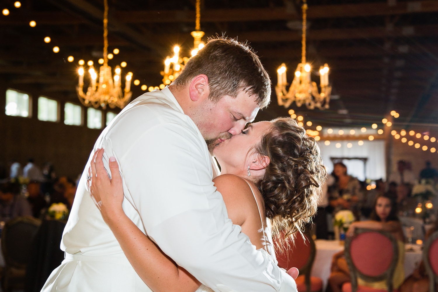 billings-montana-swift-river-ranch-wedding-reception-couple-kissing-during-first-dance.jpg