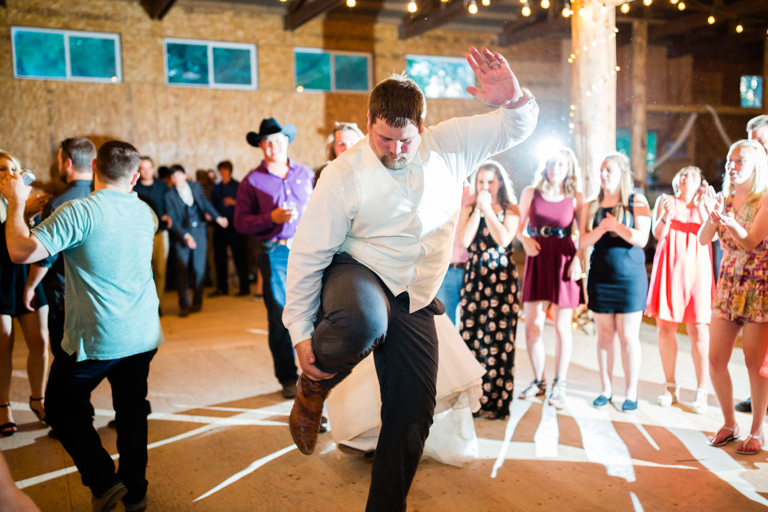 billings-montana-swift-river-ranch-wedding-reception-groom-dancing.jpg