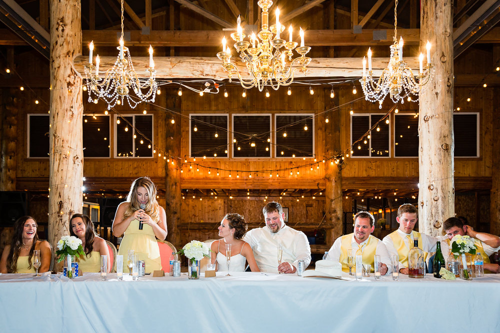 billings-montana-swift-river-ranch-wedding-reception-wedding-party-during-toasts.jpg