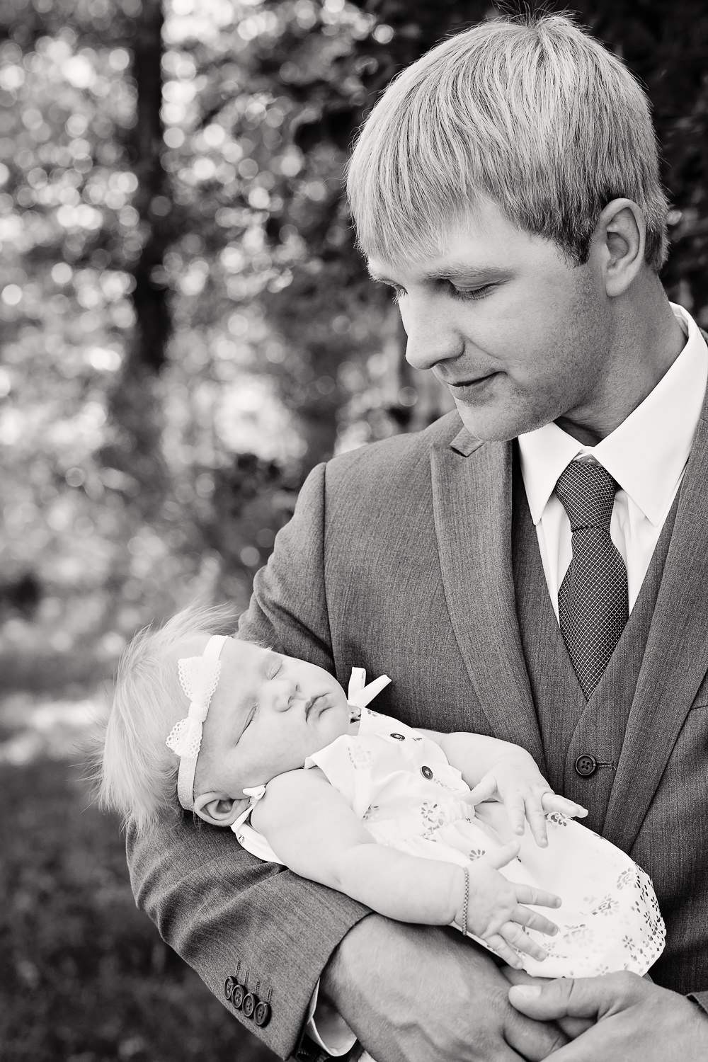 red-lodge-montana-wildflower-wedding-groom-holding-baby-daughter.jpg