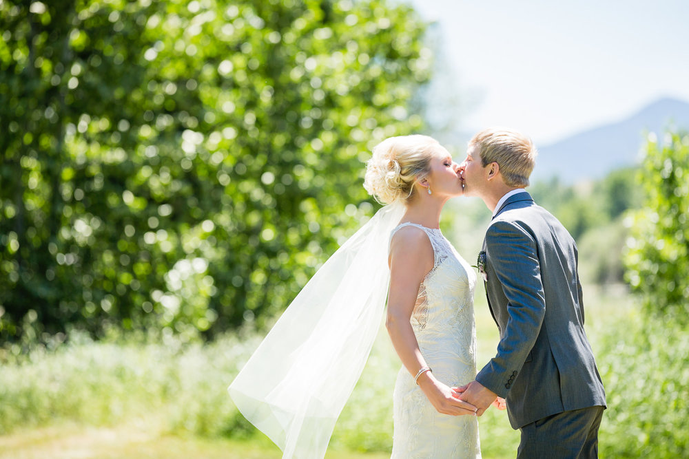 red-lodge-montana-wildflower-wedding-bride-groom-kiss-first-look.jpg