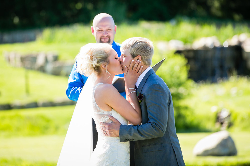 red-lodge-montana-wildflower-wedding-ceremony-kiss.jpg