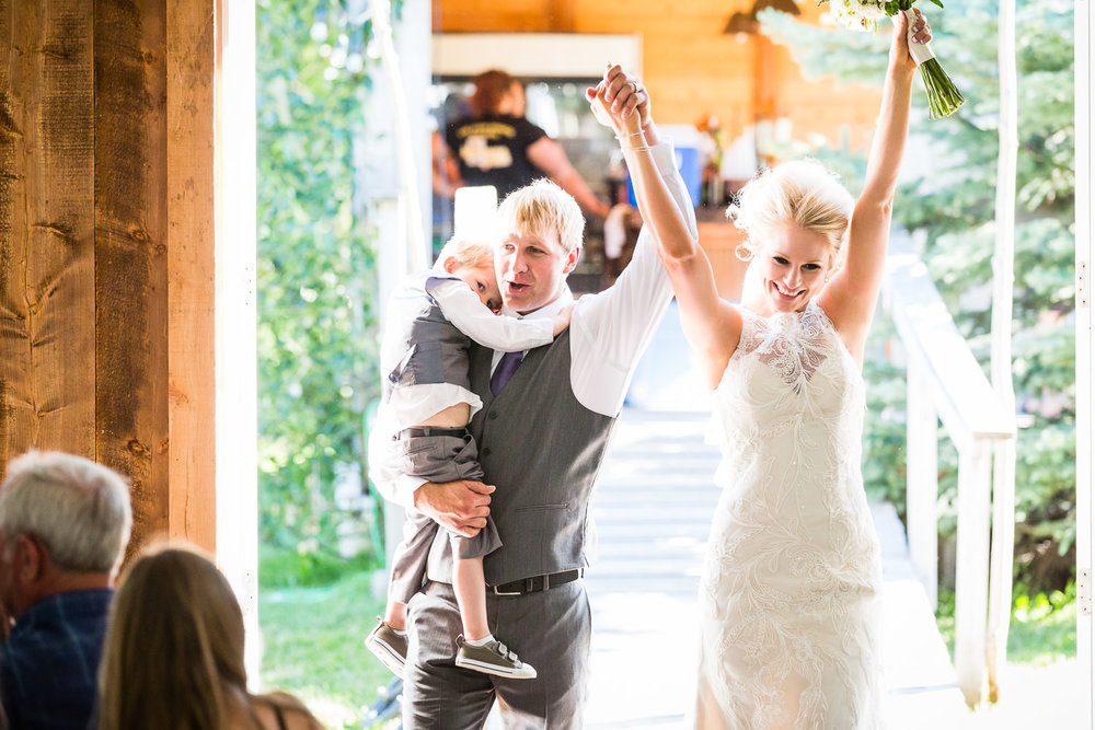 red-lodge-montana-wildflower-wedding-bride-groom-son-enter-reception.jpg