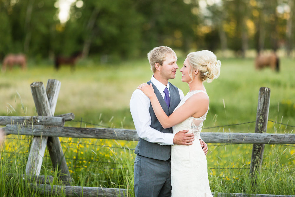 red-lodge-montana-wildflower-wedding-couple-formals-with-horse.jpg