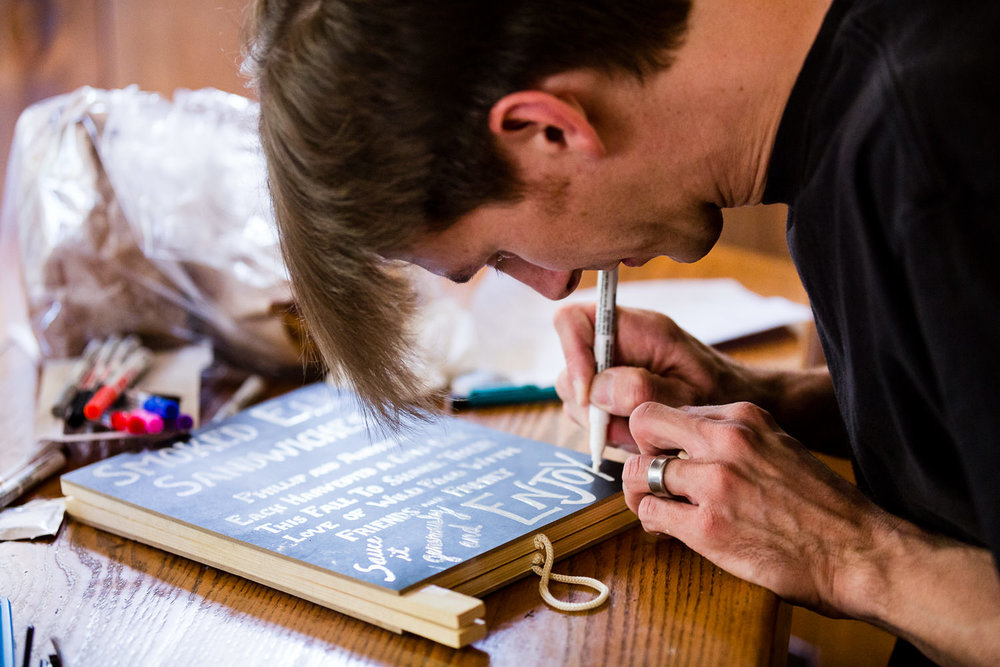 bozeman-montana-wedding-friend-prepares-menu.jpg