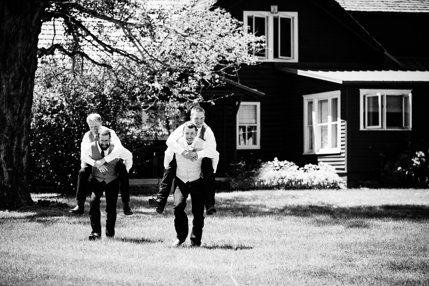 bozeman-montana-wedding-groom-and-groomsmen-piggyback-rides.jpg