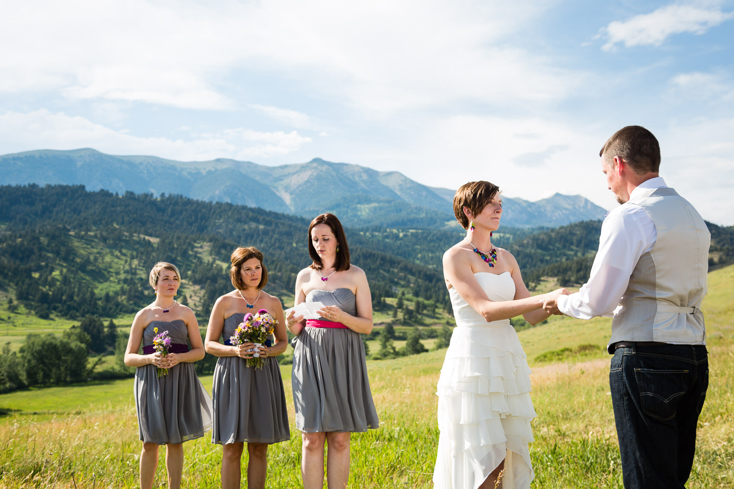 bozeman-montana-wedding-bride-groom-during-ceremony-reading.jpg