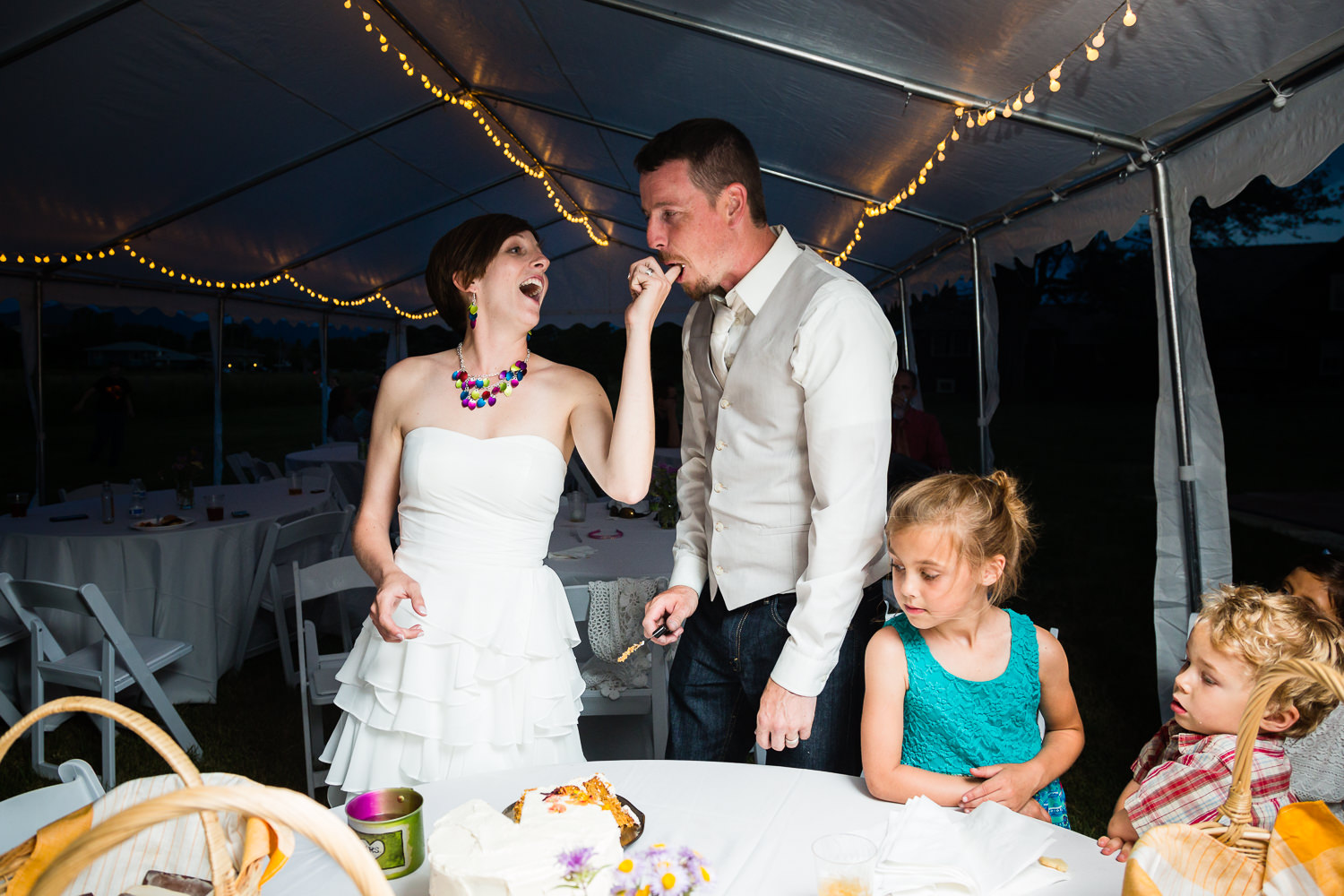 bozeman-montana-wedding-bride-feeds-groom-cake.jpg