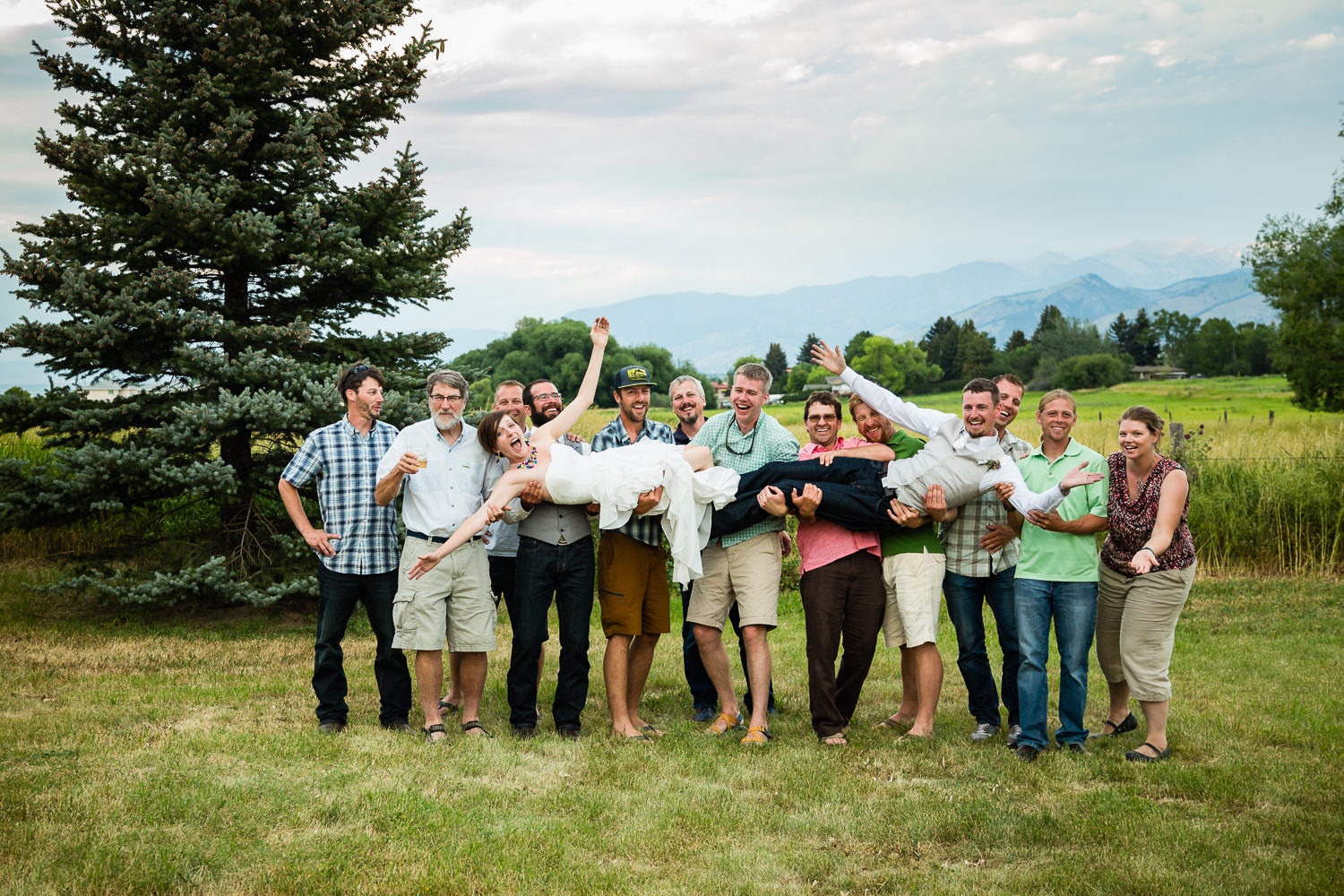 bozeman-montana-wedding-friends-lift-bride-and-groom.jpg