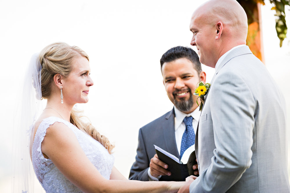 bozeman-montana-wedding-roys-barn-bride-grrom-laugh-during-ceremony.jpg