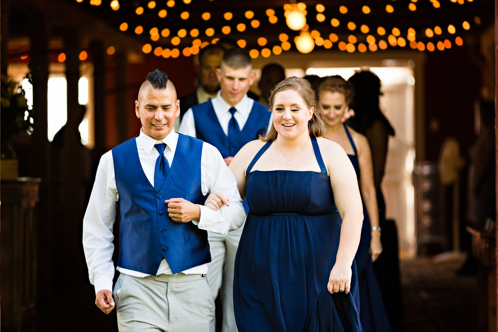 bozeman-montana-wedding-roys-barn-bridemaid-groomsmen-enter-reception.jpg